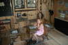 Young Visitor inside Log Shed